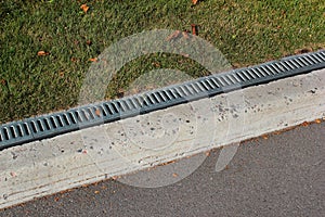 Kerbside and rainwater drainage system in a park photo