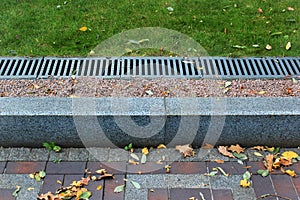 Kerbside and rainwater drainage system in a park photo