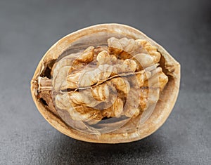 Kernel walnut on dark background.