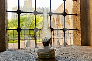 Kerosene lamp on the castle window