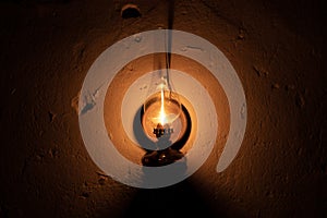 Kerosene lamp hanging on an old wall