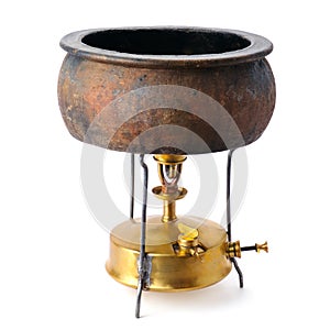Kerosene stove and a ceramic pot isolated on white