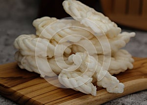 Kerupuk ikan putih or kerupuk warung is Indonesian deep fried crackers, close up photo