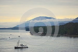 Ketchikan, Alaska, USA: A fishing boat cruises along the Tongass Narrows