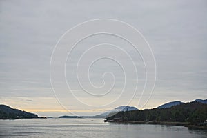 Ketchikan, Alaska, USA: Sunrise in a cloudy sky over the Tongass Narrows