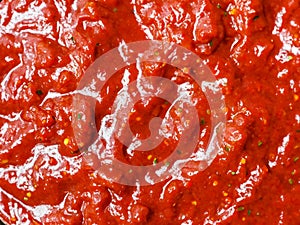 ketchup sauce in a white plate. top view