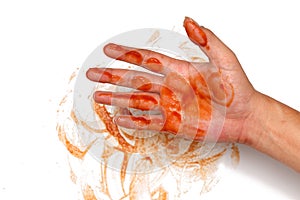 Ketchup spill stain mucky hand white background photo