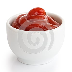 Ketchup in white ceramic ramekin.