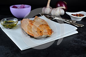 Keto Baked Trout Fillet with Red Pepper Flakes - served with garlic-infused olive oil