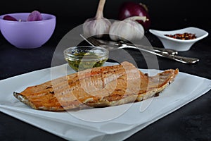 Keto Baked Trout Fillet with Red Pepper Flakes - served with garlic-infused olive oil