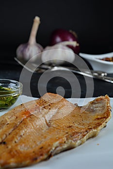 Keto Baked Trout Fillet with Red Pepper Flakes - served with garlic-infused olive oil