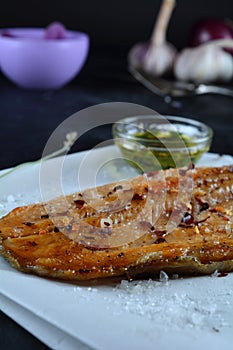 Keto Baked Trout Fillet with Red Pepper Flakes - served with garlic-infused olive oil