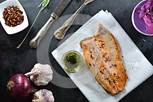 Keto Baked Trout Fillet with Red Pepper Flakes - served with garlic-infused olive oil