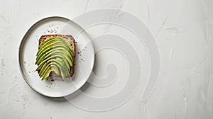 keto bread with avocado, elegantly served on a white plate atop a pristine table against a white wall backdrop