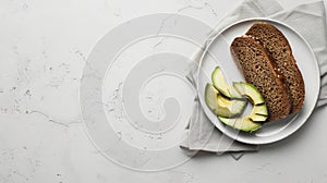 keto bread with avocado, elegantly served on a white plate atop a pristine table against a white wall backdrop