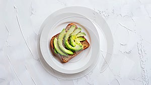 keto bread with avocado, elegantly served on a white plate atop a pristine table against a white wall backdrop