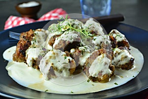 Keto Diet Beef Meatballs in Low-Carb Bechamel Sauce and Freshly Grated Parmesan