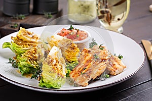 Grilled chicken fillet with mini romen and tomatoes salsa photo