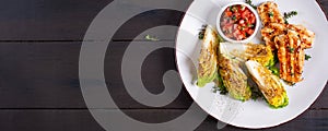 Grilled chicken fillet with mini romen and tomatoes salsa. Top view, banner photo