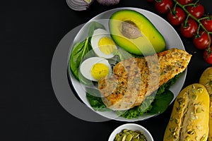 Ketogenic diet concept. A set of products of the low carb keto diet. Green vegetables, nuts, chicken fillet, flax seeds