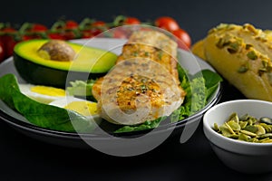 Ketogenic diet concept. A set of products of the low carb keto diet. Green vegetables, nuts, chicken fillet, flax seeds