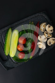 Ketogenic diet concept. A set of products of the low carb keto diet. Green vegetables, nuts, chicken fillet, flax seeds