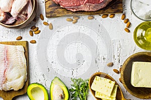 Ketogenic diet food. Balanced low-carb food background. Fish, meat, cheese, nuts on a white background. Healthy balanced food with