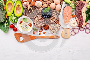 Ketogenic low carbs diet concept. Ingredients for healthy foods selection set up on white wooden background