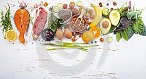 Ketogenic low carbs diet concept. Ingredients for healthy foods selection on white wooden background. Balanced healthy ingredients