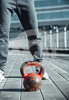 Kettle-bell close up portrait during outdoor training