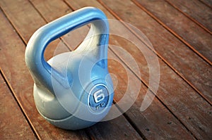 Kettle bell weight on wooden deck