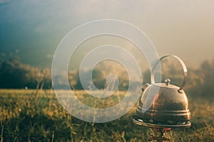 Kettle on a burner. Tea Outdoors. Making tea in the open air