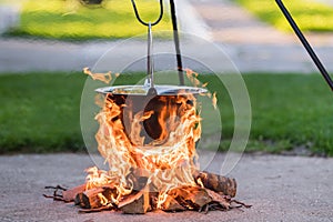 Kettle on the fire , cooking in the nature