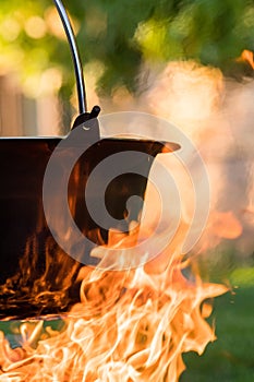 Kettle on the fire , cooking in the nature