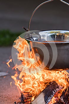 Kettle on the fire , cooking in the nature