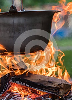 Kettle on the fire , cooking in the nature