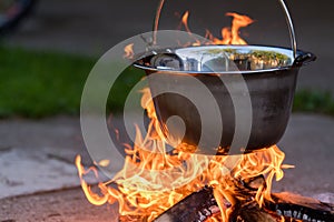 Kettle on the fire , cooking in the nature