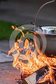 Kettle on the fire , cooking in the nature