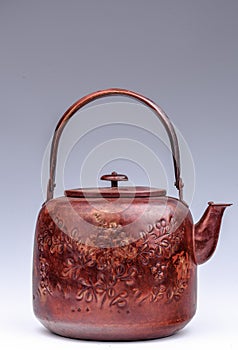 A kettle made of red copper by traditional techniques