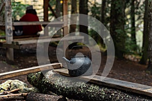 Kettle with in a tourist camp. outdoor recreation in the forest