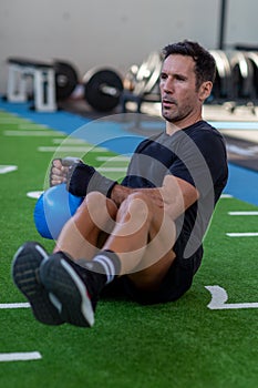 Kettlebell exercise sitting in the gym