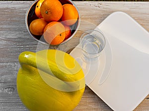 Kettlebell, tangerines, scales and glass of water