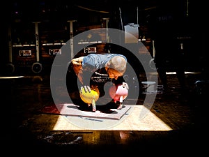 Kettlebell Trainer Performing Bottoms-up Push-ups