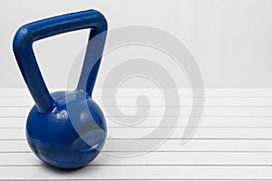 Kettlebell on a white wooden floor