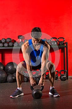 Kettlebell workout training man at gym