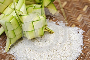 Ketupat casing and rice in bamboo container. traditional malay delicacy during Malaysian eid
