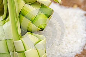 Ketupat casing and rice in bamboo container. traditional malay delicacy during Malaysian eid