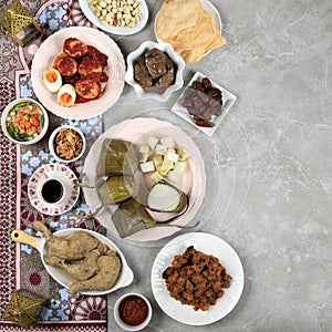 Ketupat Lebaran Ied Menu Dish, Opor Ayam, Sambal Goreng Ati Kentang, Balado Telur, Dates Fruit, Sambal, and Tea photo