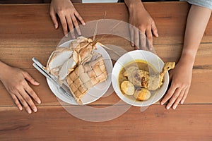 Ketupat and opor ayam for ramadan celebration photo