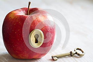 Key and apple, key to health. Healthy eating concept